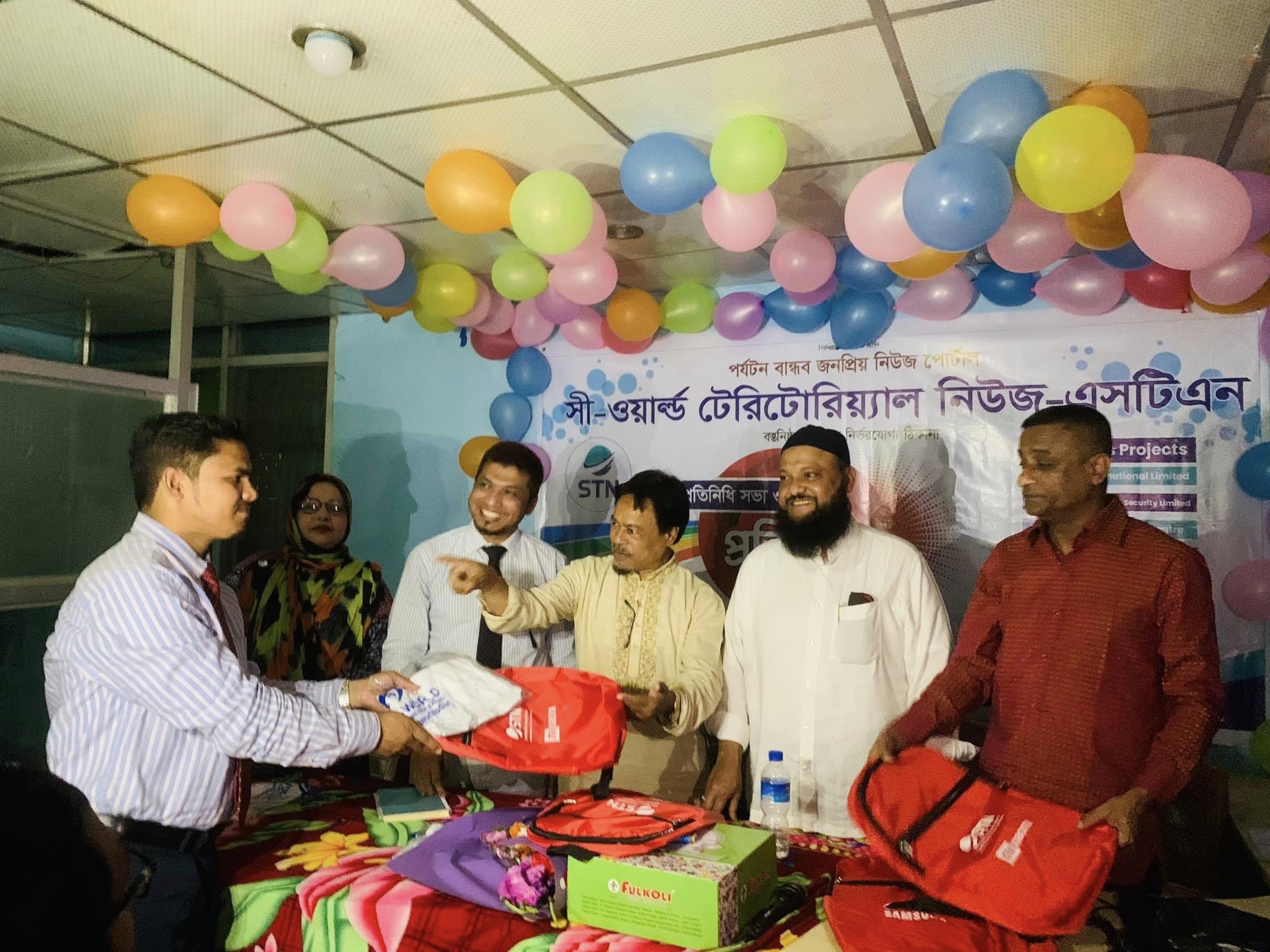 T-Shirt and office bag are handed over by STN Chief Editor Shamsul Hoque Sarek